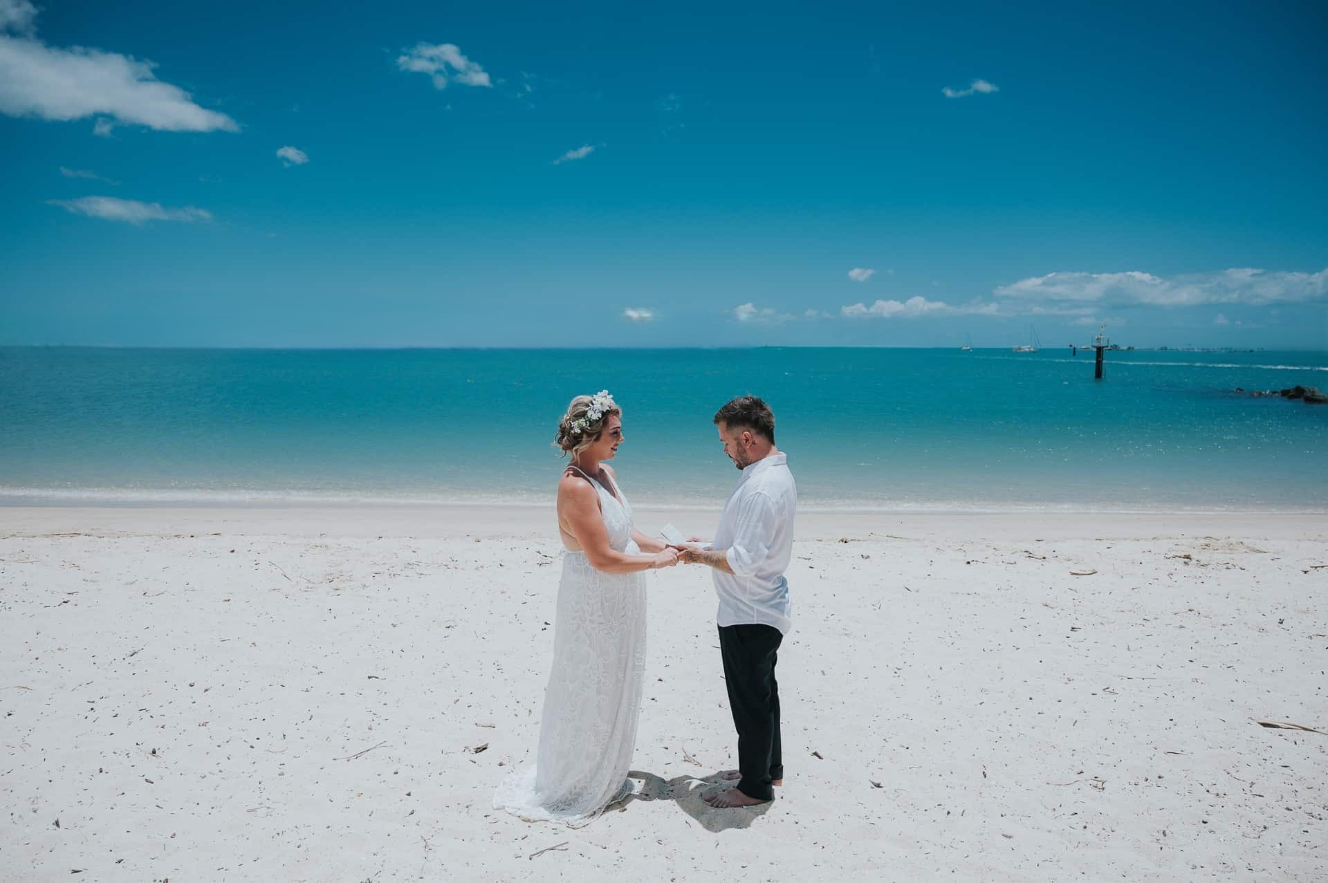 Elegant Fort De Soto Beach wedding décor with arch and florals