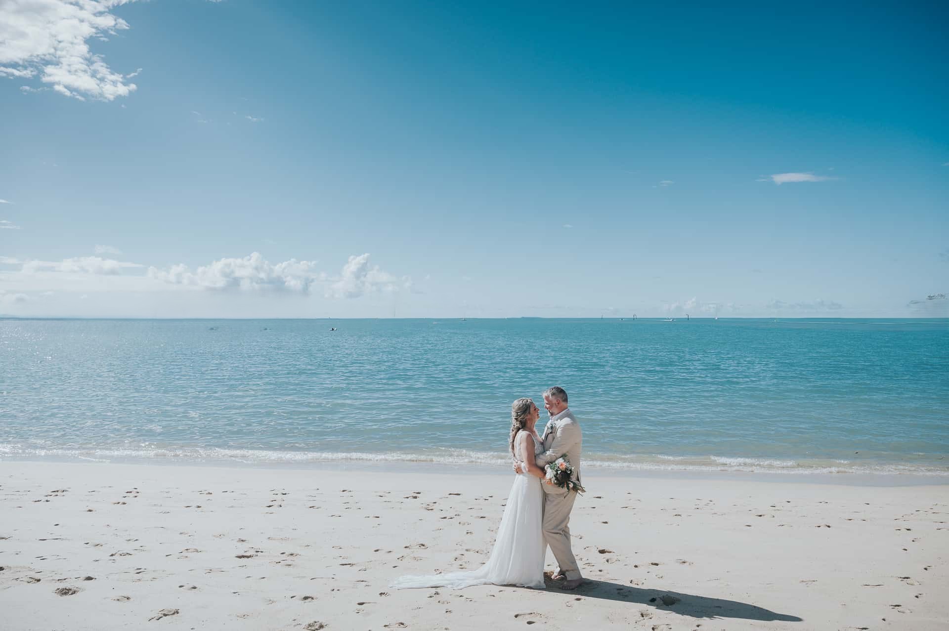Owen and Jane’s wedding ceremony at Clearwater Beach with golden sunset backdrop