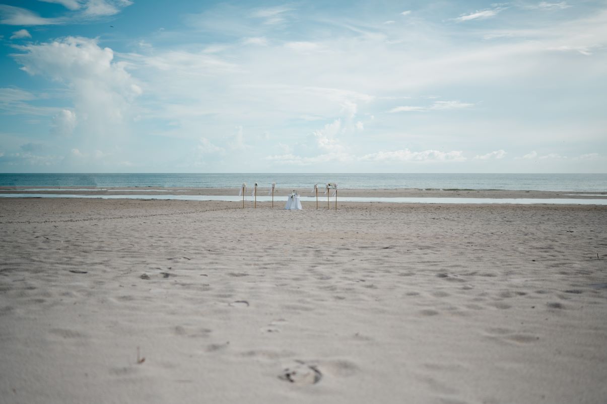 Bride and groom exchanging vows at Indian Rocks Beach wedding