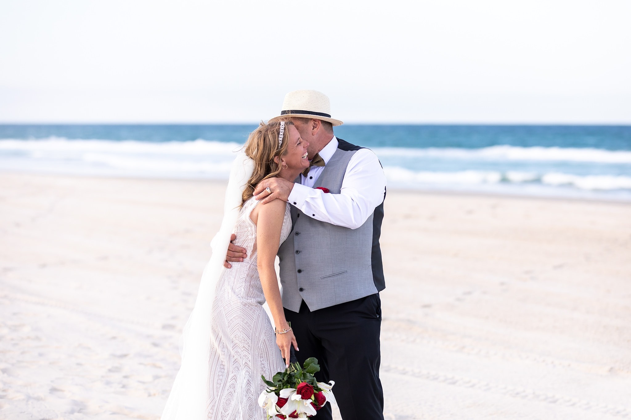 Clearwater Beach Wedding wedding arch setup with Gulf Coast backdrop
