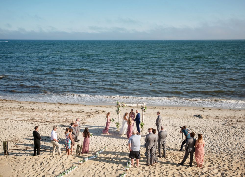 Upham Beach wedding celebration with guests and Gulf Coast views